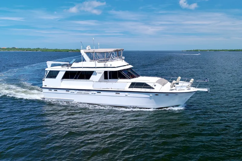 The Image of 1994 Jefferson Marquessa 56 Extended Deckhouse yacht cruising on open water. - 0