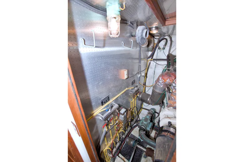 Slide: The Image of Engine room of 1994 Jefferson Marquessa 56 Extended Deckhouse with visible pipes and machinery. - 99