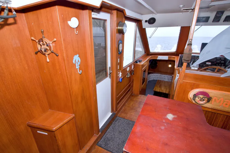 Slide: The Image of Interior of 1994 Jefferson Marquessa 56 yacht with wooden decor and nautical accents. - 40