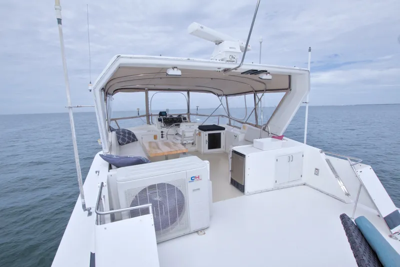 Slide: The Image of 1994 Jefferson Marquessa 56 Extended Deckhouse yacht with spacious deck and ocean view. - 11