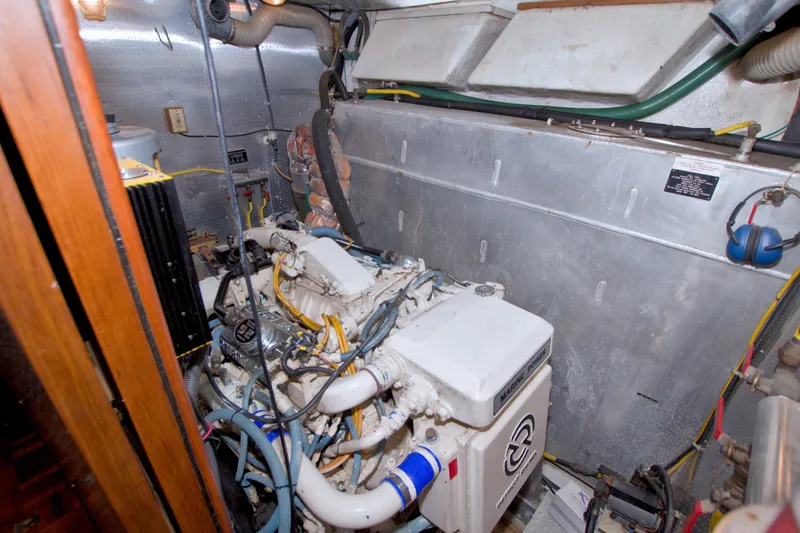 Slide: The Image of Engine room of 1994 Jefferson Marquessa 56 Extended Deckhouse yacht, showcasing marine engine components. - 106