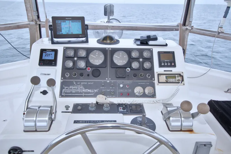 Slide: The Image of Cockpit of 1994 Jefferson Marquessa 56 Extended Deckhouse yacht with navigation instruments and controls. - 22