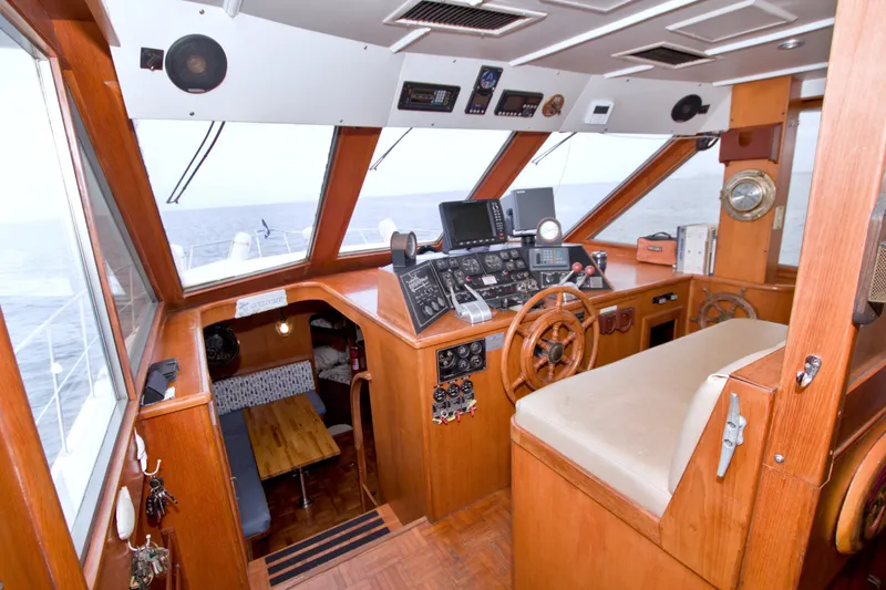 Slide: The Image of 1994 Jefferson Marquessa 56 yacht helm with wooden interior and navigation equipment. - 52