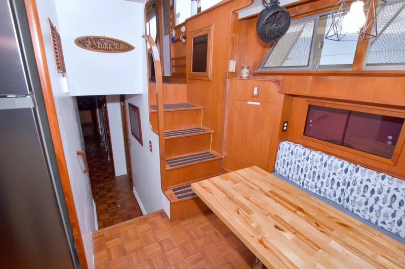 Slide: The Image of Interior of 1994 Jefferson Marquessa 56 yacht with wooden decor and dining area. - 70