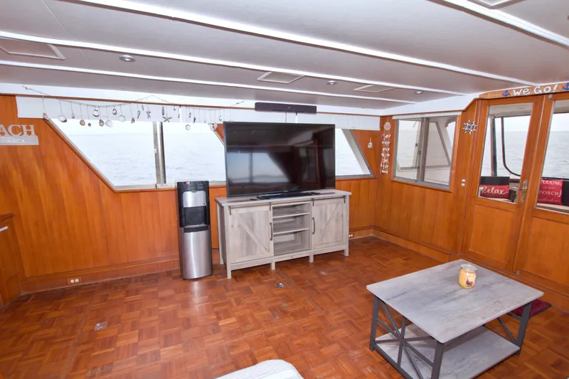 Slide: The Image of Spacious interior of 1994 Jefferson Marquessa 56 yacht with wood paneling and modern amenities. - 28
