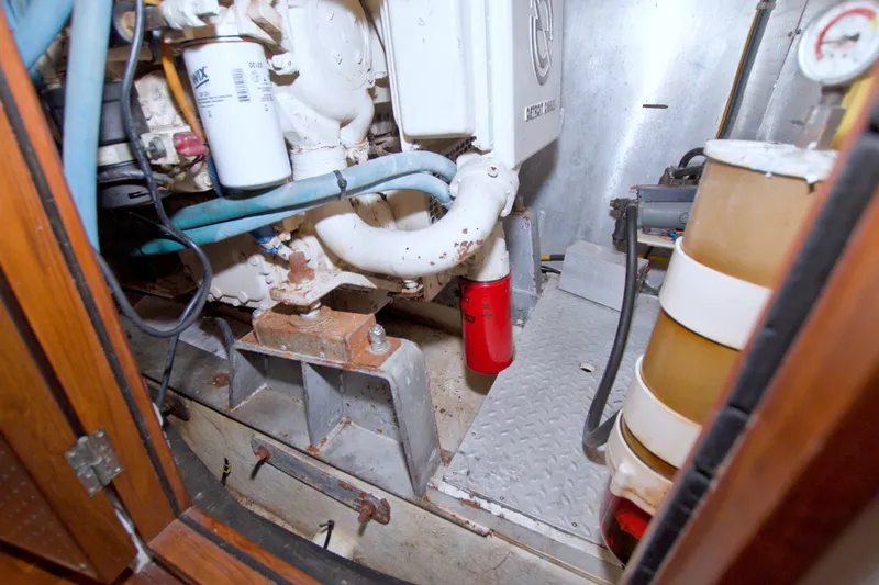 Slide: The Image of Engine room of 1994 Jefferson Marquessa 56 Extended Deckhouse yacht, showcasing mechanical components. - 107