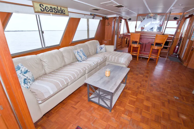 Slide: The Image of Luxurious 1994 Jefferson Marquessa 56 yacht interior with cozy seating and nautical decor. - 35