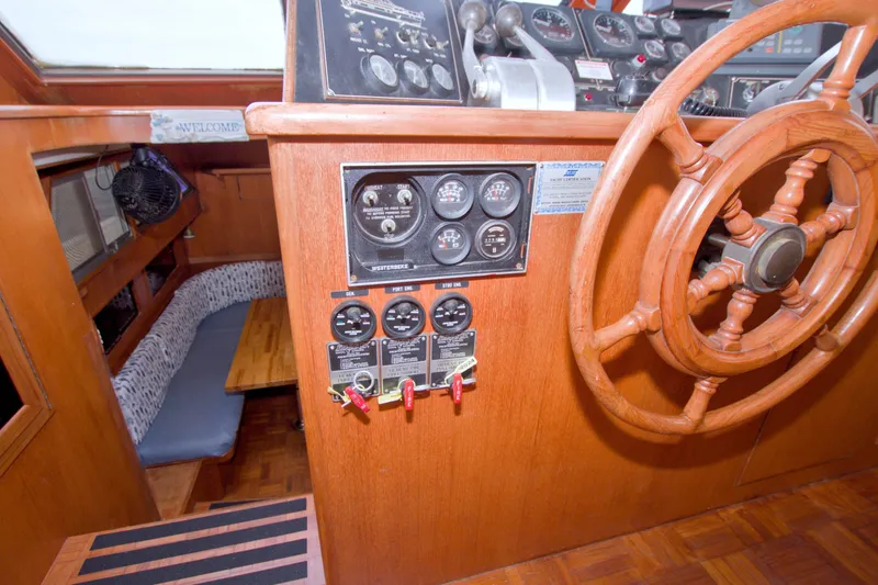 Slide: The Image of Wooden helm and control panel of 1994 Jefferson Marquessa 56 yacht interior. - 55
