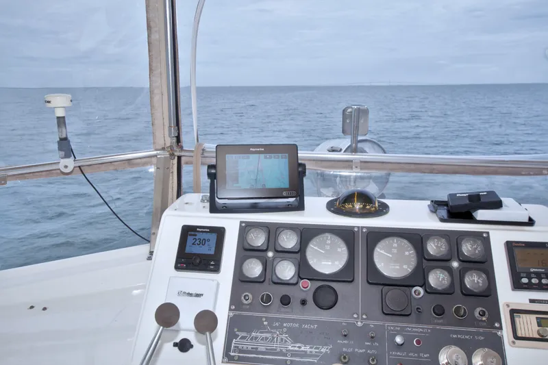Slide: The Image of Cockpit view of 1994 Jefferson Marquessa 56 yacht with navigation instruments and ocean backdrop. - 23