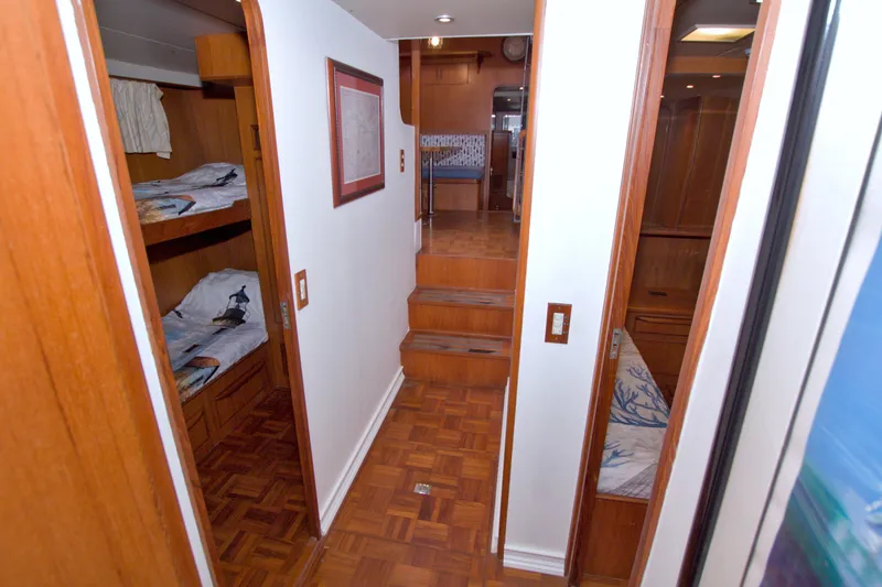 Slide: The Image of Interior of 1994 Jefferson Marquessa 56 yacht with wood paneling and cozy cabins. - 72