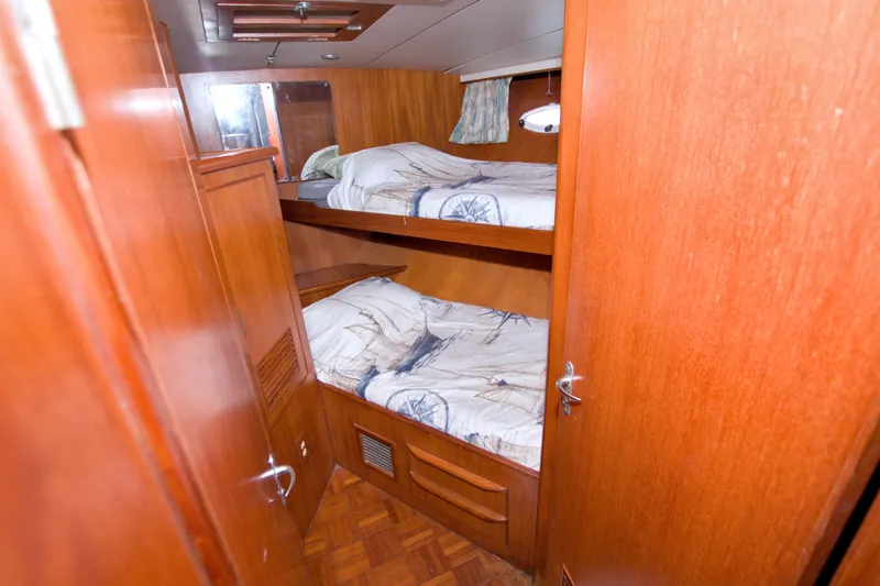 Slide: The Image of Cozy wooden cabin with bunk beds in 1994 Jefferson Marquessa 56 yacht. - 63