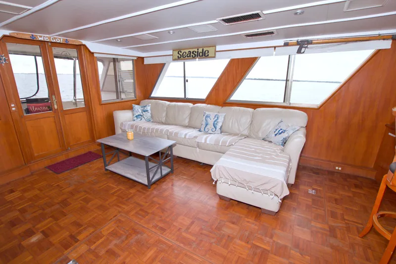Slide: The Image of Luxurious interior of 1994 Jefferson Marquessa 56 yacht with leather sofa and wooden decor. - 27