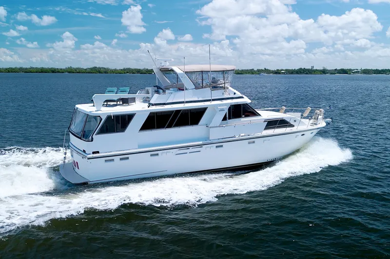 Slide: The Image of 1994 Jefferson Marquessa 56 yacht cruising on open water under a clear blue sky. - 5