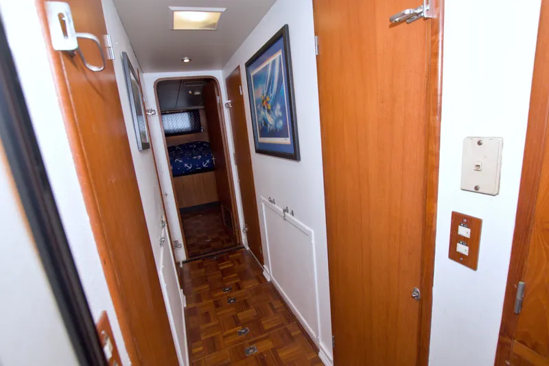 Slide: The Image of Hallway inside 1994 Jefferson Marquessa 56 yacht, featuring wood paneling and nautical decor. - 85