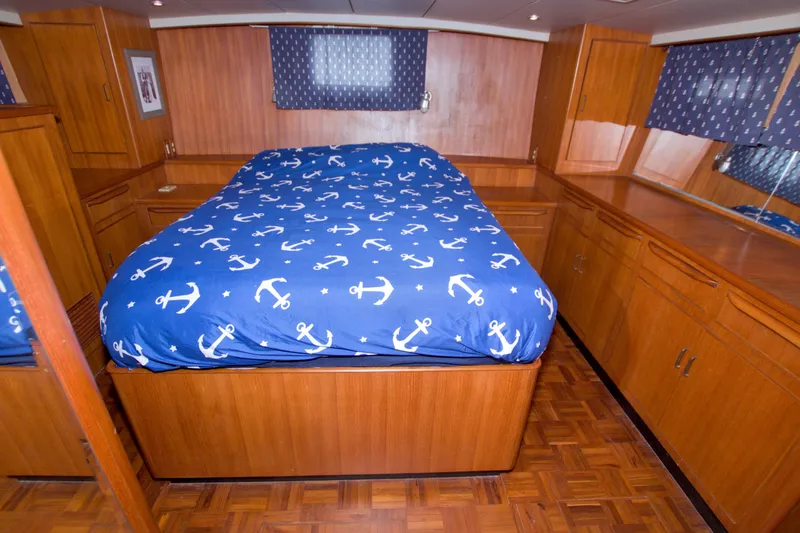 Slide: The Image of Luxurious cabin interior of 1994 Jefferson Marquessa 56 yacht with nautical-themed bedding. - 88