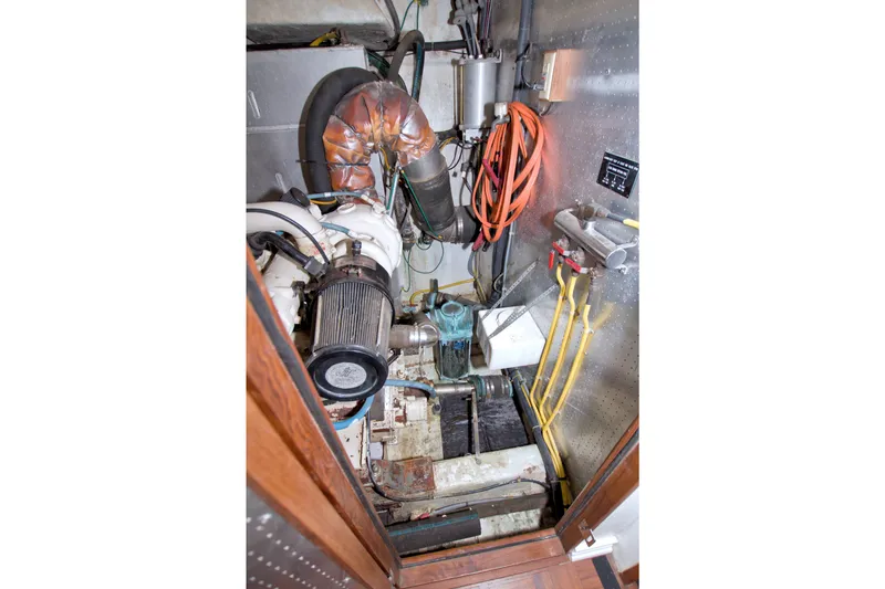 Slide: The Image of Engine room of 1994 Jefferson Marquessa 56 Extended Deckhouse yacht, featuring mechanical components. - 119
