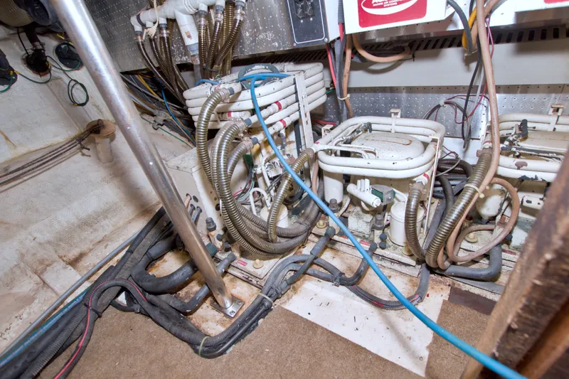 Slide: The Image of Engine room of 1994 Jefferson Marquessa 56 Extended Deckhouse with complex wiring and machinery. - 126