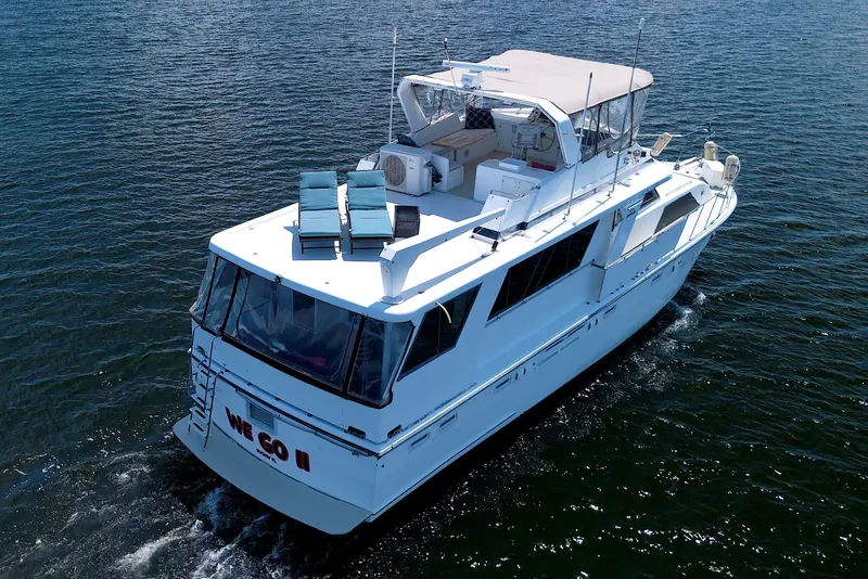 Slide: The Image of 1994 Jefferson Marquessa 56 Extended Deckhouse yacht cruising on open water. - 3