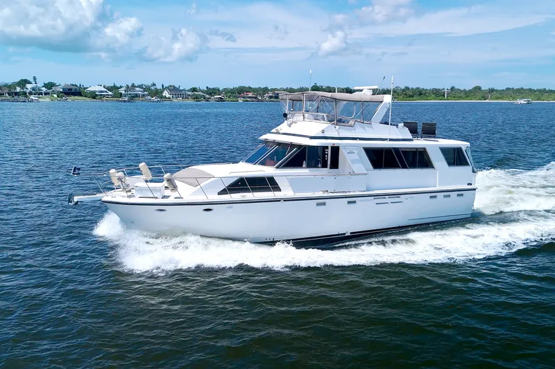 Slide: The Image of 1994 Jefferson Marquessa 56 yacht cruising on open water under a clear sky. - 10