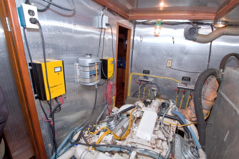 Slide: The Image of Engine room of 1994 Jefferson Marquessa 56 yacht with visible machinery and wiring. - 105