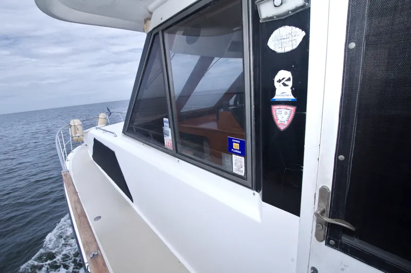 Slide: The Image of 1994 Jefferson Marquessa 56 yacht deckhouse with ocean view and window stickers. - 42