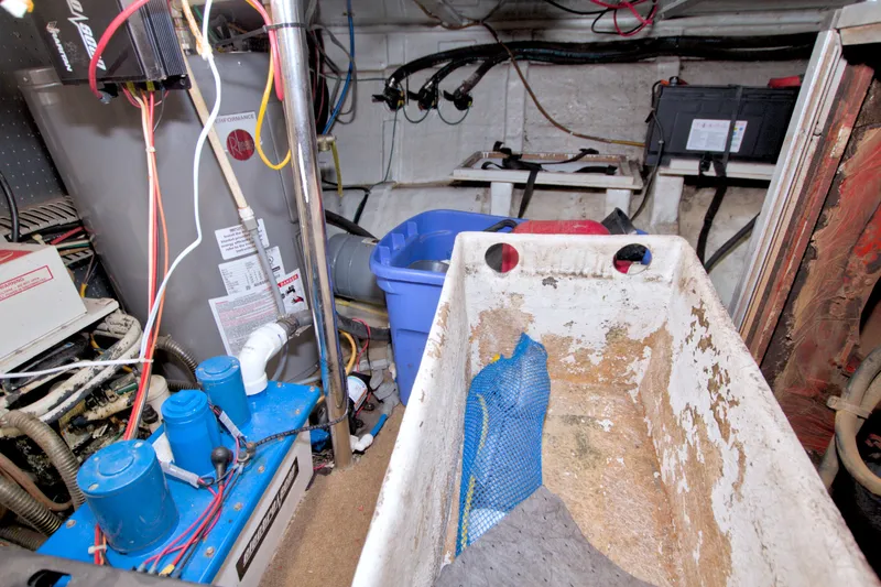 Slide: The Image of Engine room of 1994 Jefferson Marquessa 56 yacht, featuring equipment and wiring. - 129