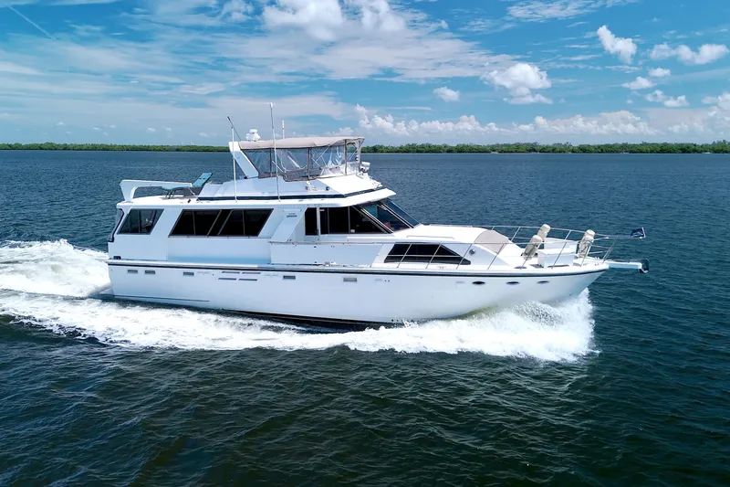 Slide: The Image of 1994 Jefferson Marquessa 56 yacht cruising on open water under a clear blue sky. - 6