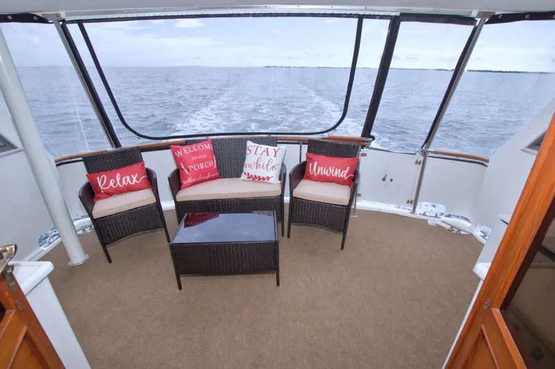 Slide: The Image of 1994 Jefferson Marquessa 56 yacht deck with cozy seating and ocean view. - 30