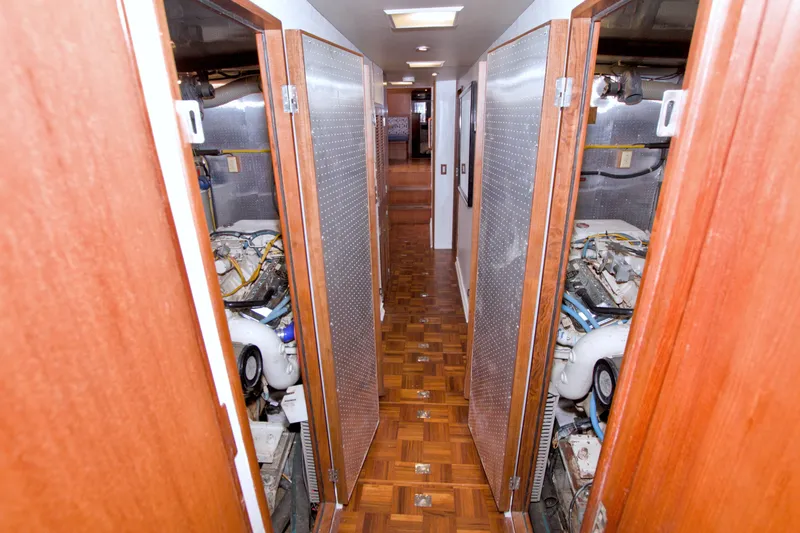 Slide: The Image of Engine room corridor of 1994 Jefferson Marquessa 56 yacht, featuring wooden flooring and open access panels. - 97