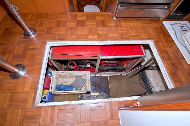 Slide: The Image of Engine compartment of a 1994 Jefferson Marquessa 56 Extended Deckhouse yacht with parquet flooring. - 121
