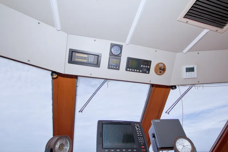Slide: The Image of Interior view of 1994 Jefferson Marquessa 56 yacht's control panel with navigation instruments. - 53