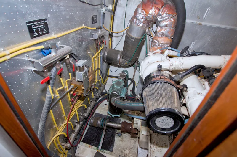 Slide: The Image of Engine room of a 1994 Jefferson Marquessa 56 Extended Deckhouse yacht, showcasing mechanical components. - 100