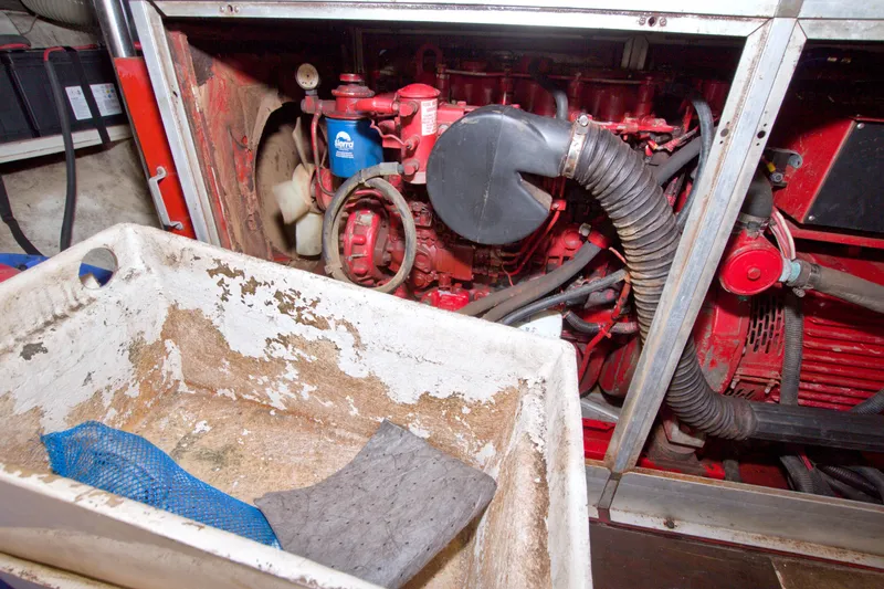 Slide: The Image of Engine room of a 1994 Jefferson Marquessa 56 Extended Deckhouse yacht, showing machinery and maintenance tools. - 122