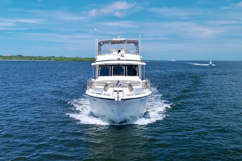 Slide: The Image of 1994 Jefferson Marquessa 56 yacht cruising on open water under a clear blue sky. - 7