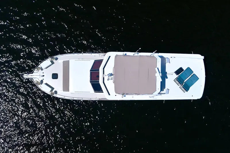 Slide: The Image of Aerial view of 1994 Jefferson Marquessa 56 yacht on shimmering water. - 1