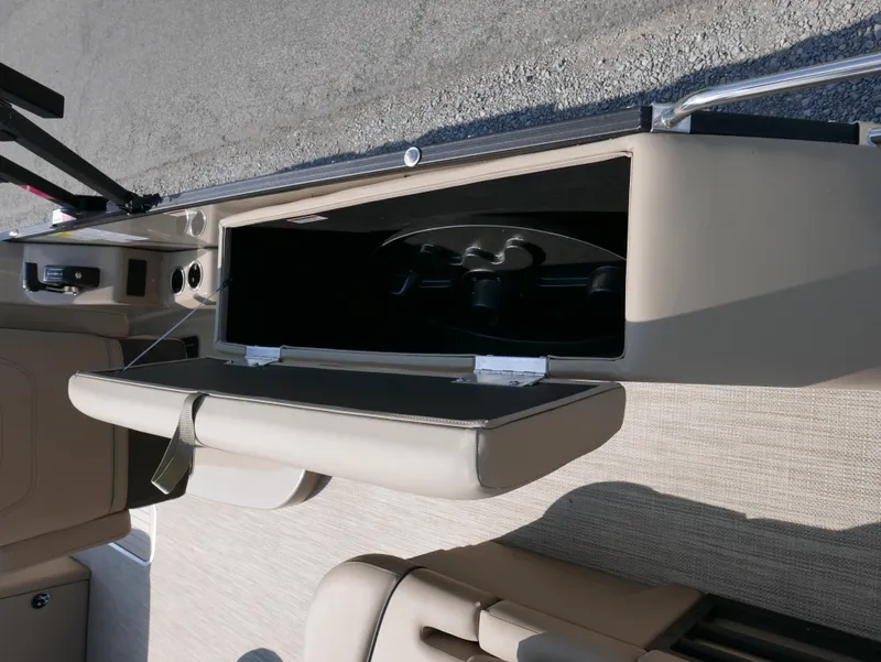 Slide: The Image of 2024 Starcraft SLS 3 Q DH boat interior storage compartment with beige seating. - 16