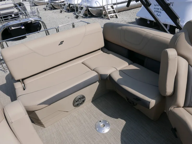 Slide: The Image of 2024 Starcraft SLS 3 Q DH boat interior with beige seating and speaker system. - 18