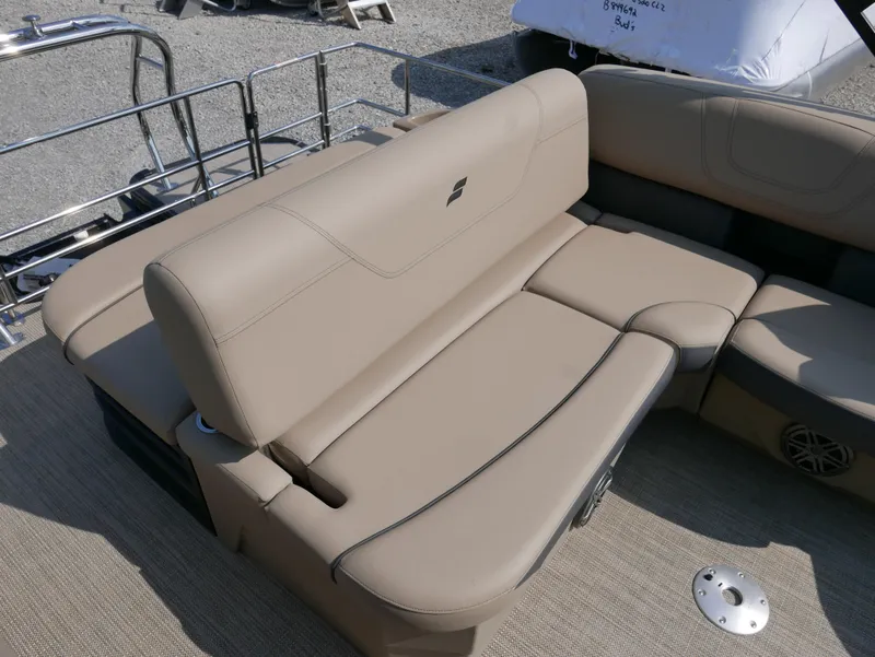 Slide: The Image of 2024 Starcraft SLS 3 Q DH boat interior with beige seating and stainless steel railing. - 19