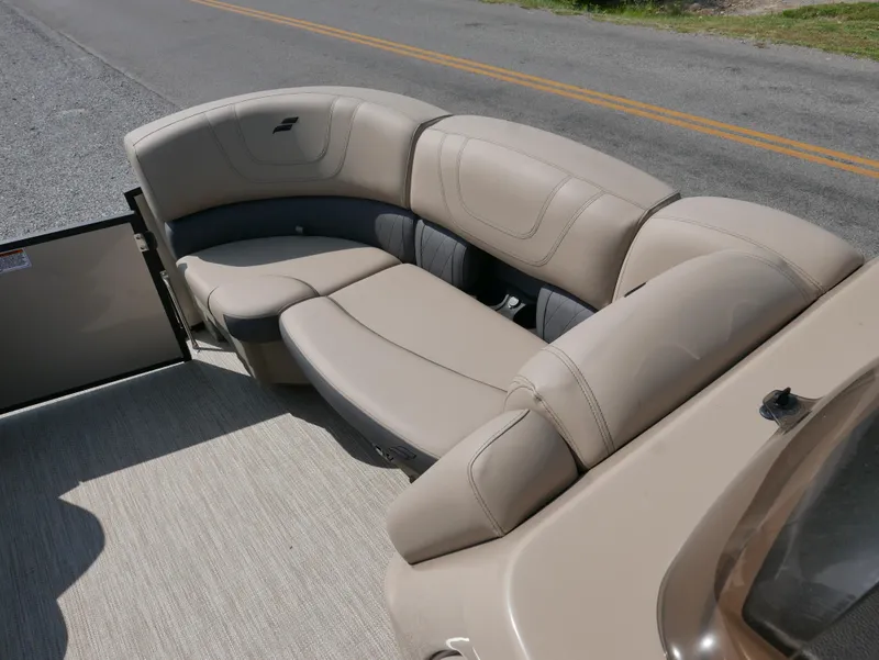 Slide: The Image of 2024 Starcraft SLS 3 Q DH boat interior with beige seating on a sunny day. - 6
