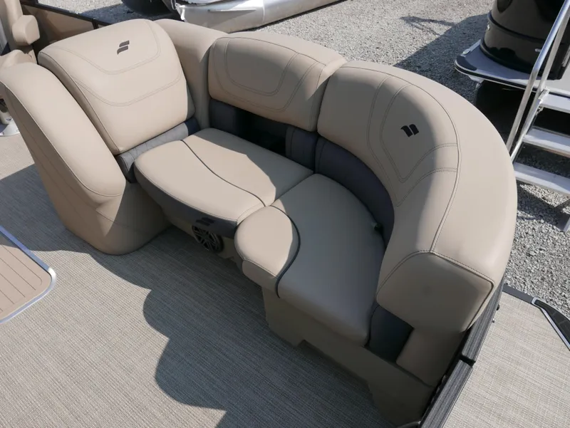 Slide: The Image of 2024 Starcraft SLS 3 Q DH boat seating, beige upholstery, curved design, outdoor setting. - 9