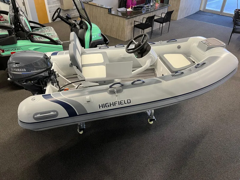 Slide: The Image of 2024 Highfield Classic 310 inflatable boat with Yamaha outboard motor in showroom. - 3