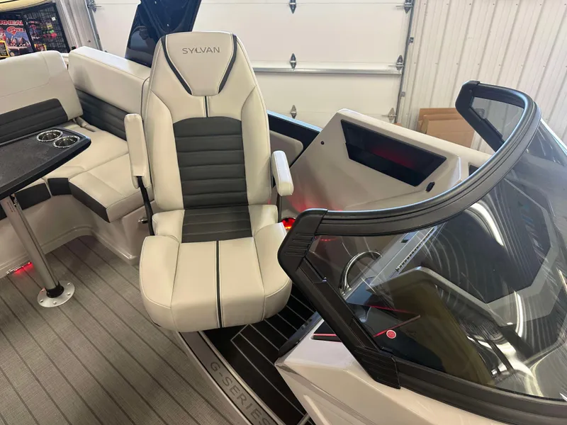 Slide: The Image of 2024 Sylvan G3 CLZ DC boat interior with sleek seating and modern dashboard. - 14