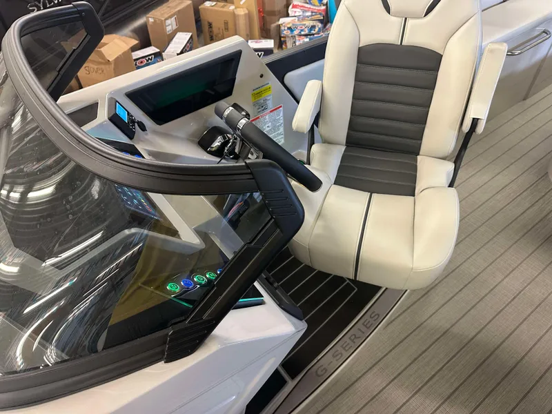 Slide: The Image of 2024 Sylvan G3 CLZ DC boat interior with modern helm and comfortable seating. - 15