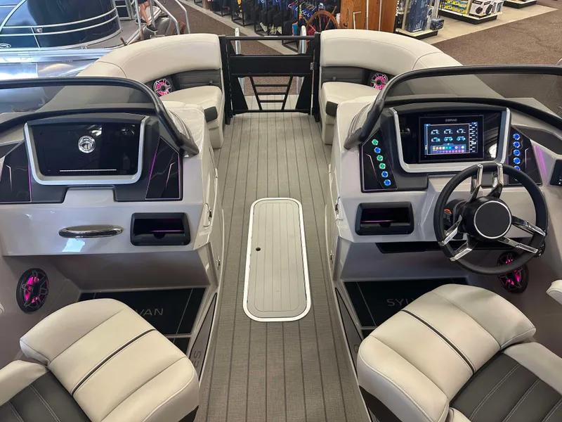 Slide: The Image of 2024 Sylvan G3 CLZ DC boat interior with modern dashboard and seating. - 16