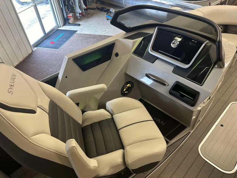 Slide: The Image of 2024 Sylvan G3 CLZ DC boat interior with modern dashboard and comfortable seating. - 17