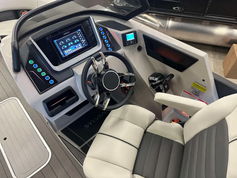 Slide: The Image of 2024 Sylvan G3 CLZ DC boat dashboard with modern controls and steering wheel. - 18