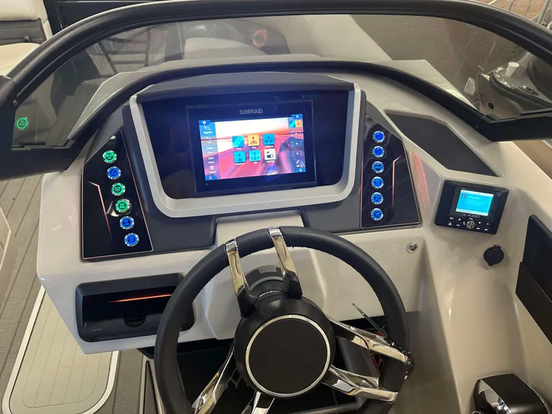 Slide: The Image of 2024 Sylvan G3 CLZ DC boat dashboard with touchscreen and modern controls. - 19