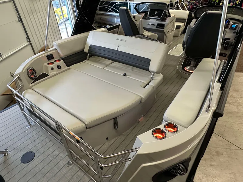 Slide: The Image of 2024 Sylvan G3 CLZ DC boat interior with plush seating and modern controls. - 24