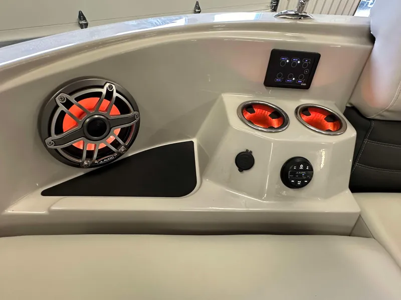 Slide: The Image of 2024 Sylvan G3 CLZ DC boat interior with illuminated speakers and control panel. - 25