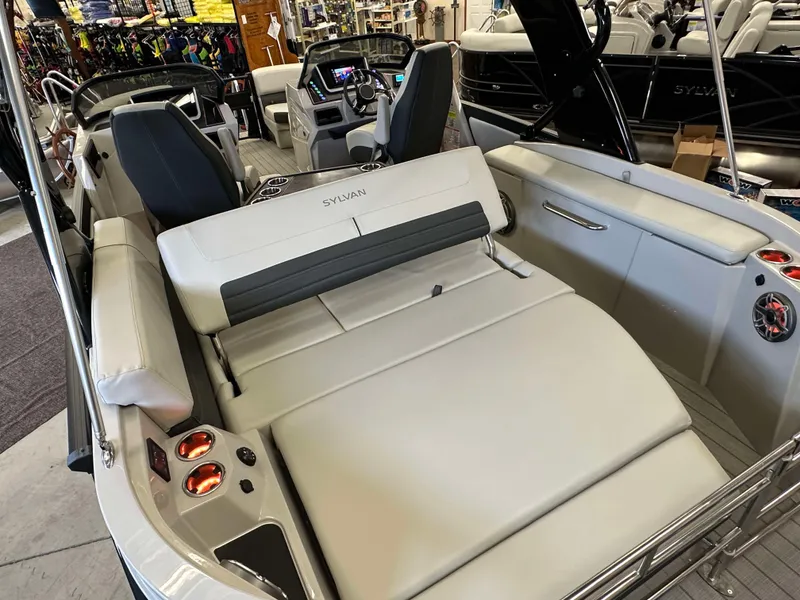 Slide: The Image of 2024 Sylvan G3 CLZ DC boat interior with luxurious seating and modern dashboard. - 26
